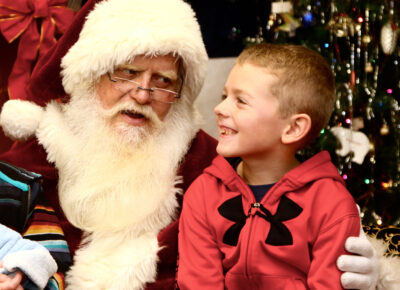 Child talking with Santa